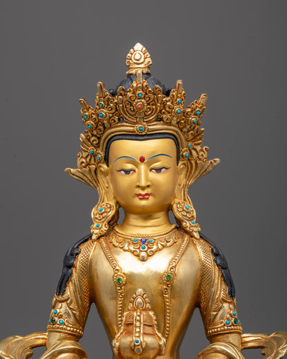 Closeup Amitayus face 24K gold gilded Long Life Buddha Sculpture with semi-precious stones

