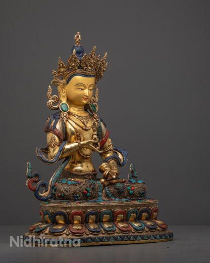Intricate jewelry carving and inlaid turquoise, coral, and lapis lazuli stones on Vajrasattva statue, reflecting Buddhist symbolism and artisan skill