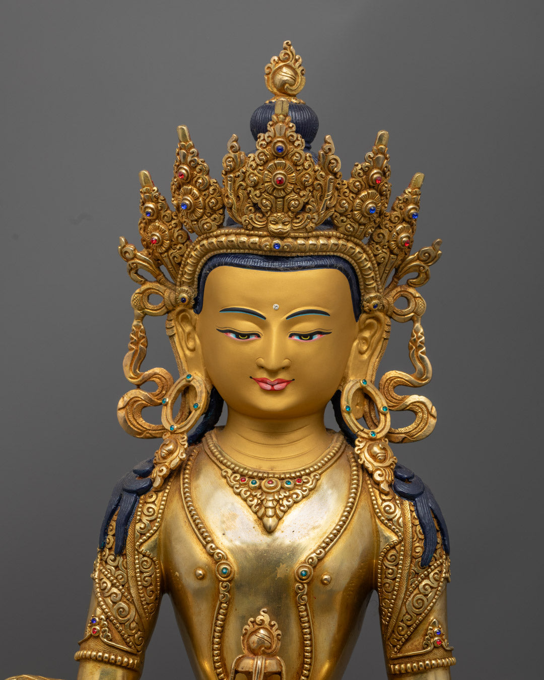 Amitayus Buddha’s tranquil face with delicate gold finish, radiating compassion, peace, and spiritual wisdom.