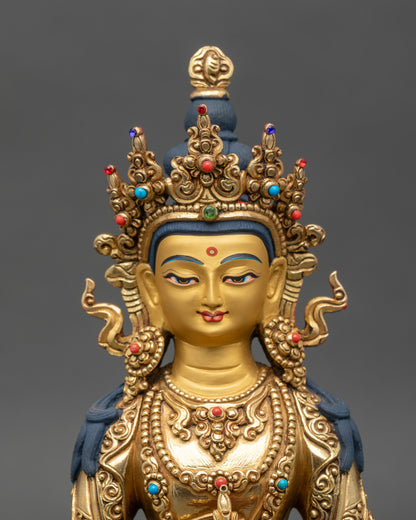 Amitayus Buddha statue close-up, serene expression, gold fire-gilded surface