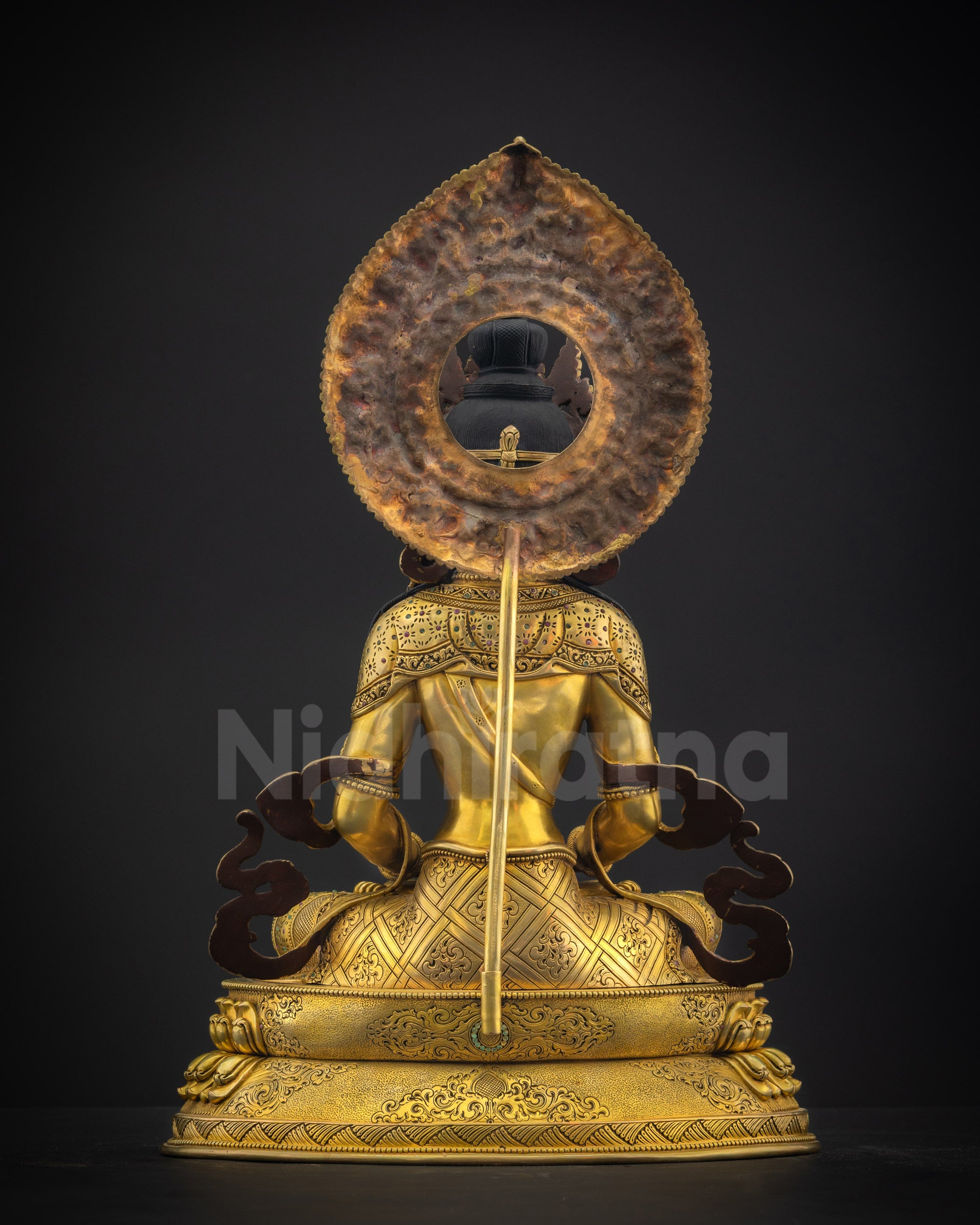Back view of Amitayus Masterpiece showing carved robes, flowing lower garments, and divine halo
