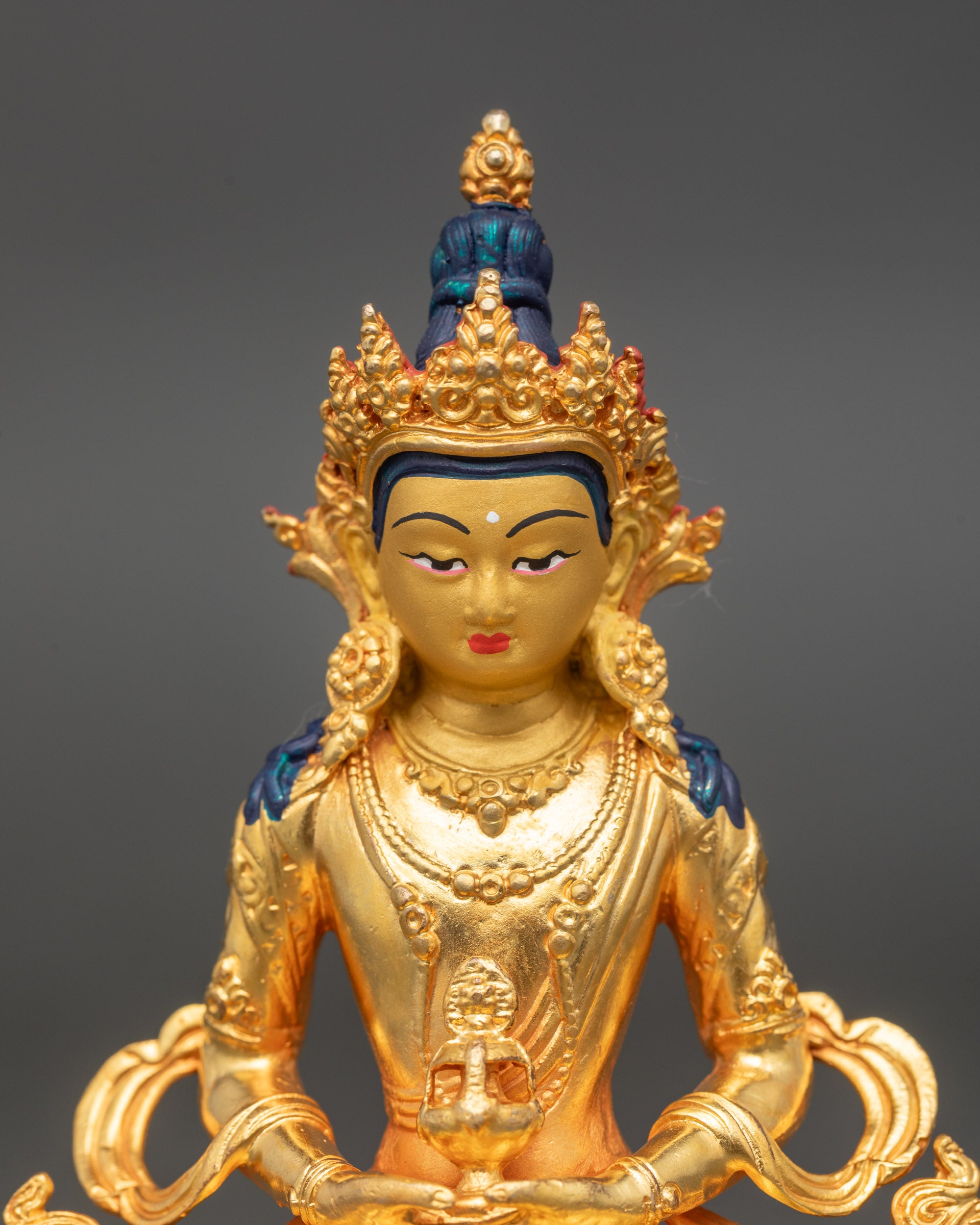 Amitayus Statue detailed close up face serene gold-painted features Himalayan art