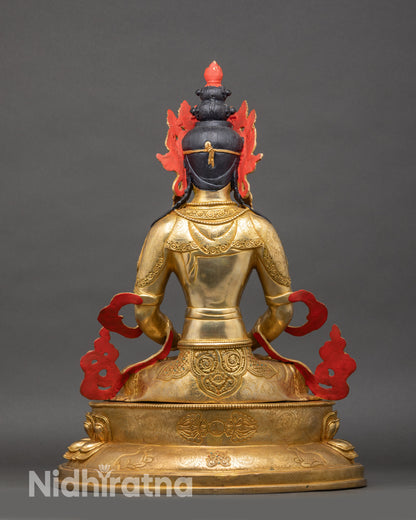 Back view of Amitayus statue, engraved lotus pedestal and flowing monastic robes