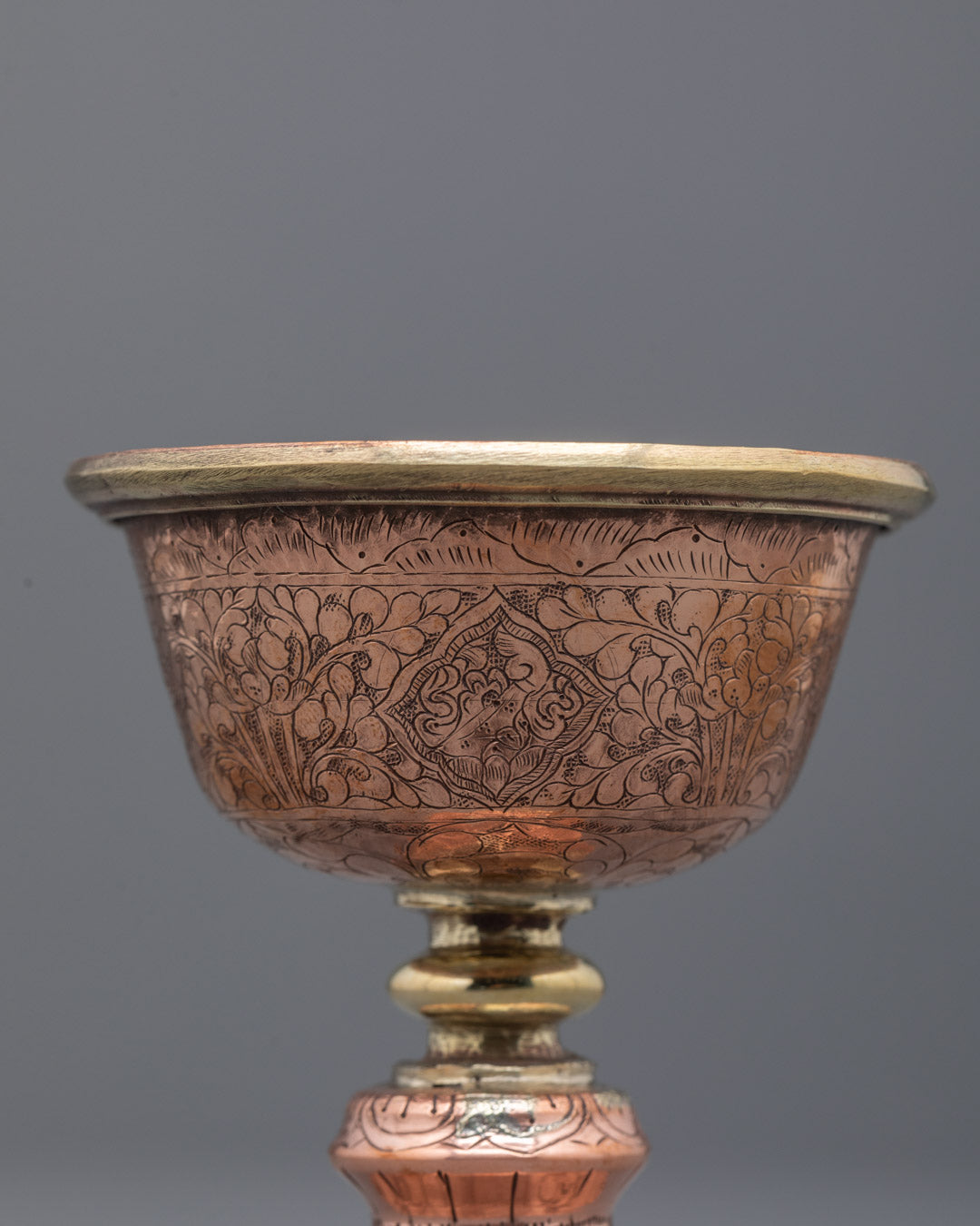 Angled close-up of Tibetan butter lamp symbolizing wisdom and spiritual clarity