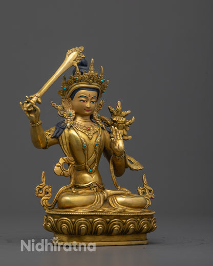 Angled side view of the Manjushri Statue revealing the elegant sword