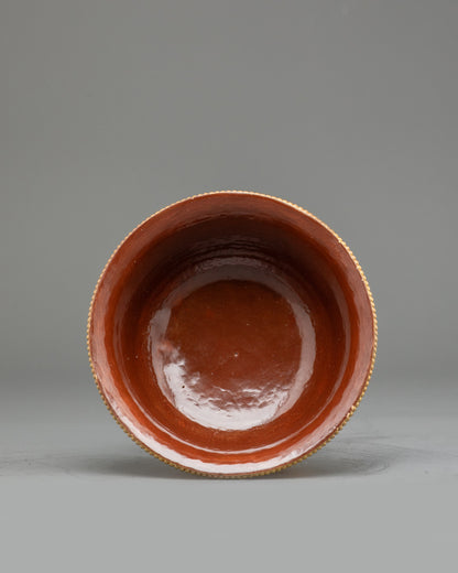 Angled view gold-plated Tibetan water offering bowls arranged for Buddhist altar practice