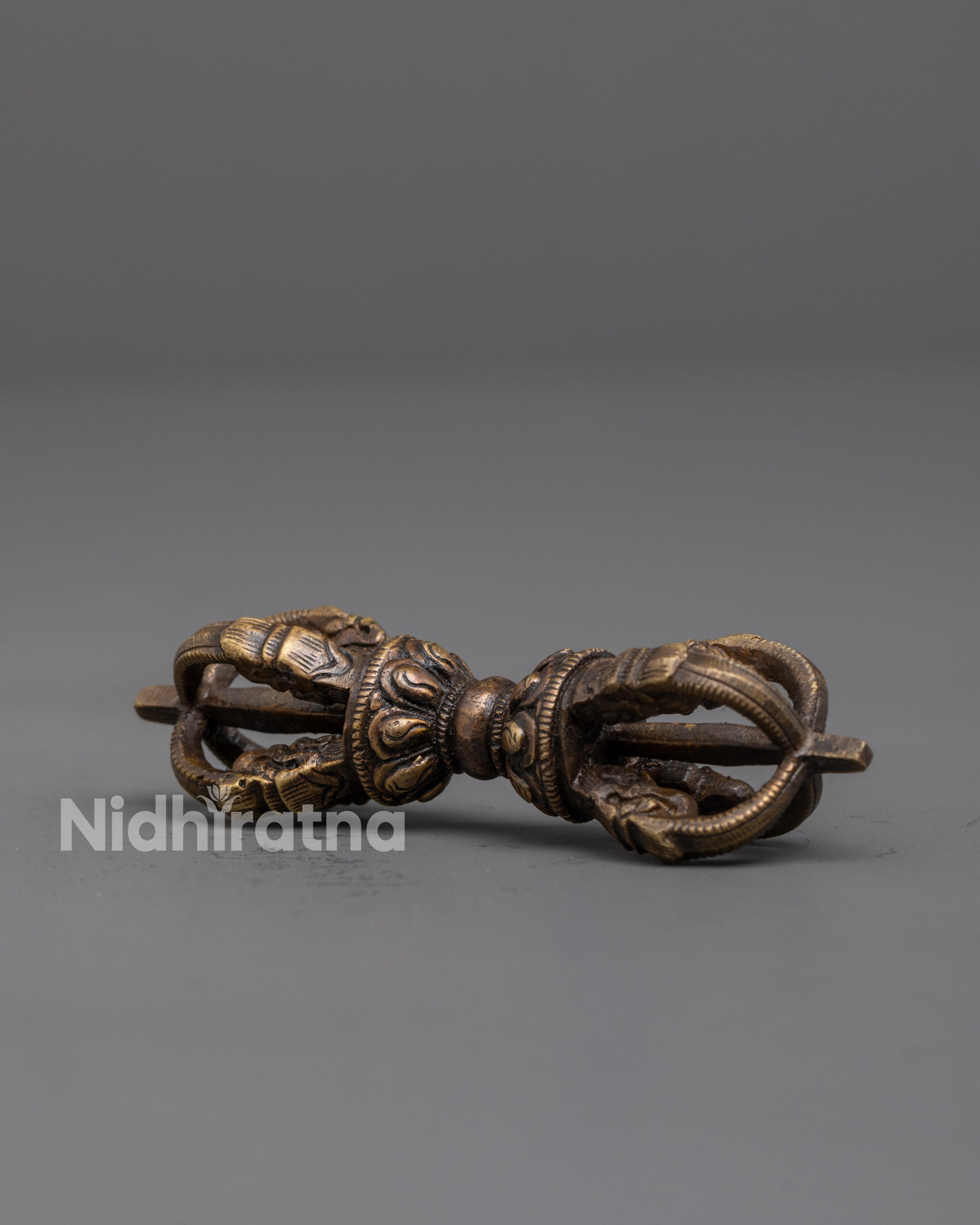 Artisan-crafted Vajra and Bell set displayed on meditation altar