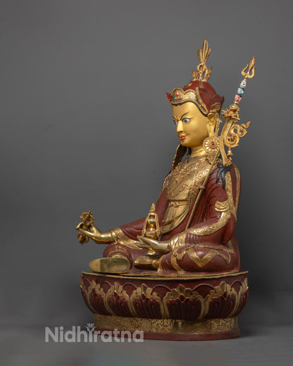 Artisan from Nepal skillfully crafting the Guru Rinpoche Statue using the traditional lost wax method in a workshop environment.