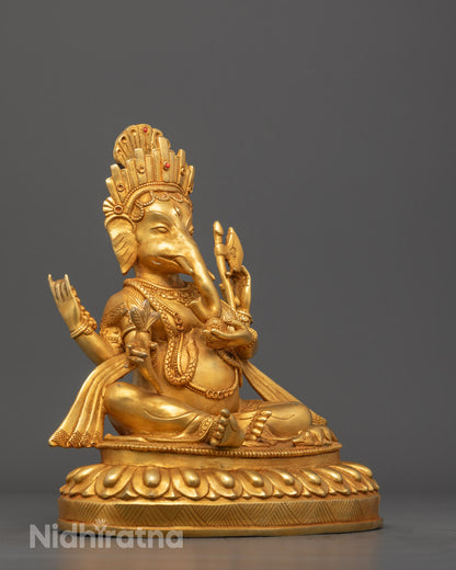 Artistic shot of the Ganesh statue’s hand-carved details, emphasizing the rich textures, 24k gold plating, and vivid red acrylic finish.
