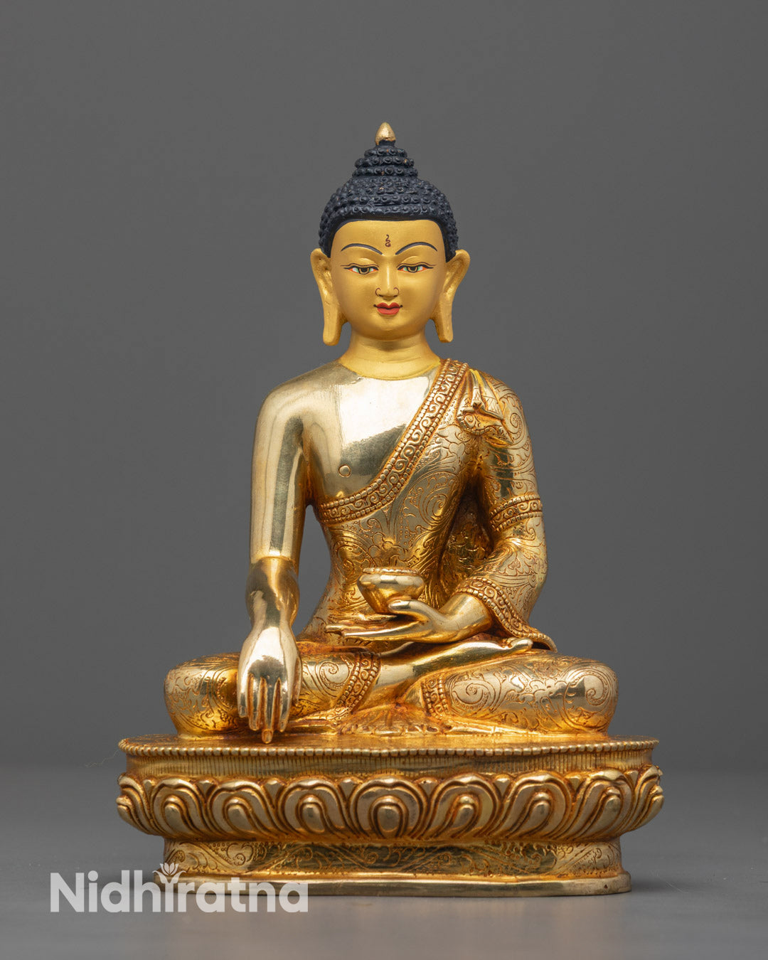 Authentic Gautam Buddha Statue handcrafted in Nepal with 24k gold-gilded face and fire-gilded body, perfect for meditation and spiritual decor.