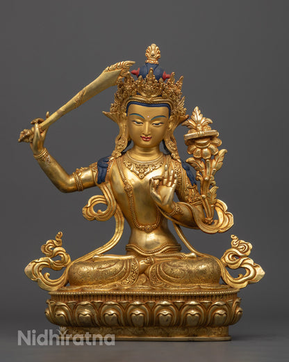 Authentic Manjushri statue with 24k gold-gilded face and fire-gilded copper body, handcrafted using the traditional lost wax method, featuring intricate carvings and a wisdom flame sword, symbolizing enlightenment and clarity.