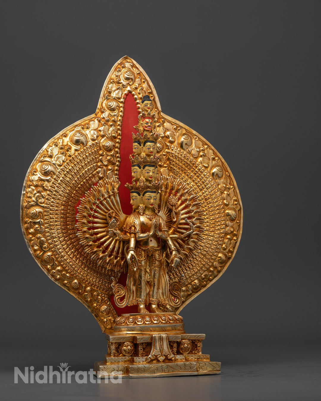 Avalokiteshvara statue with thousand arms and eyes on palms symbolizing infinite compassion and all-seeing wisdom