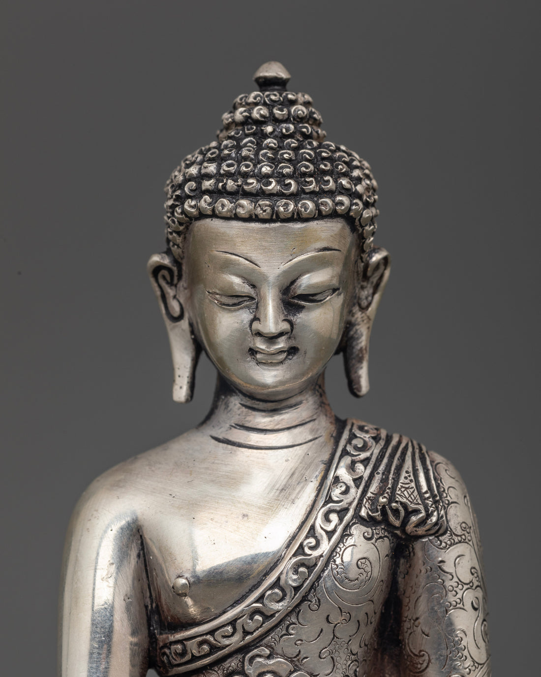 Silver Illumination: The Tranquil Aura of Shakyamuni Buddha