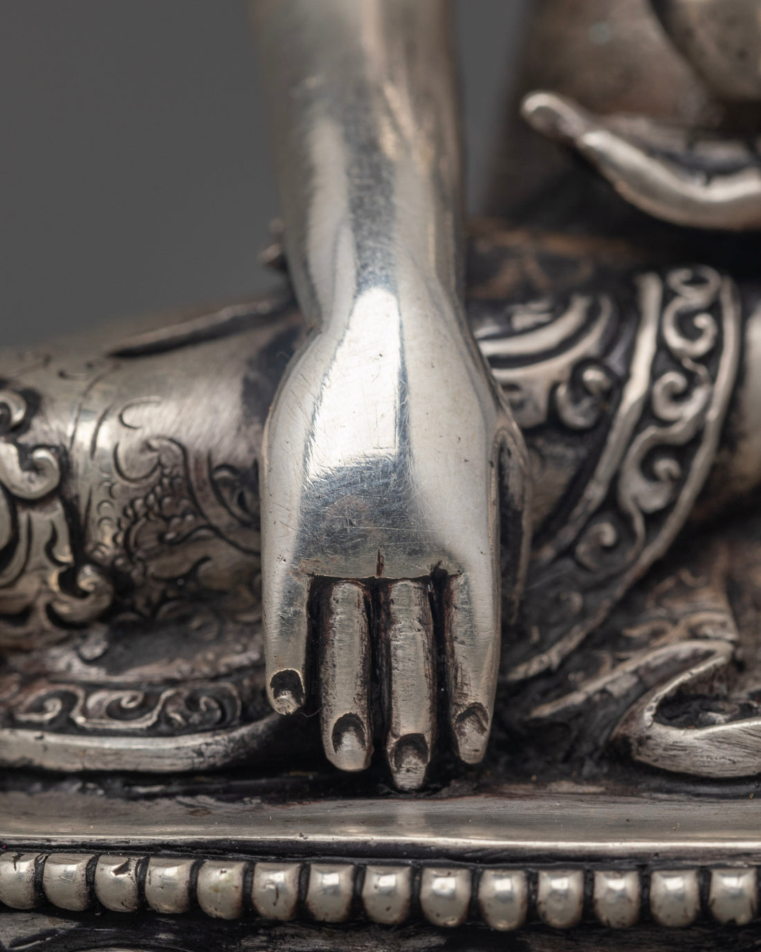 Silver Illumination: The Tranquil Aura of Shakyamuni Buddha