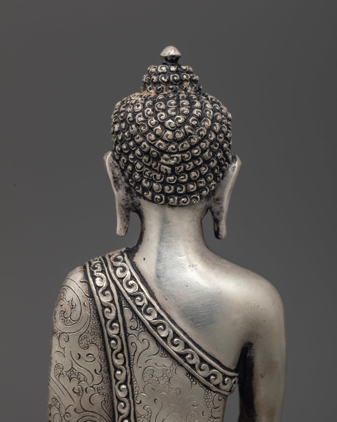 Silver Illumination: The Tranquil Aura of Shakyamuni Buddha