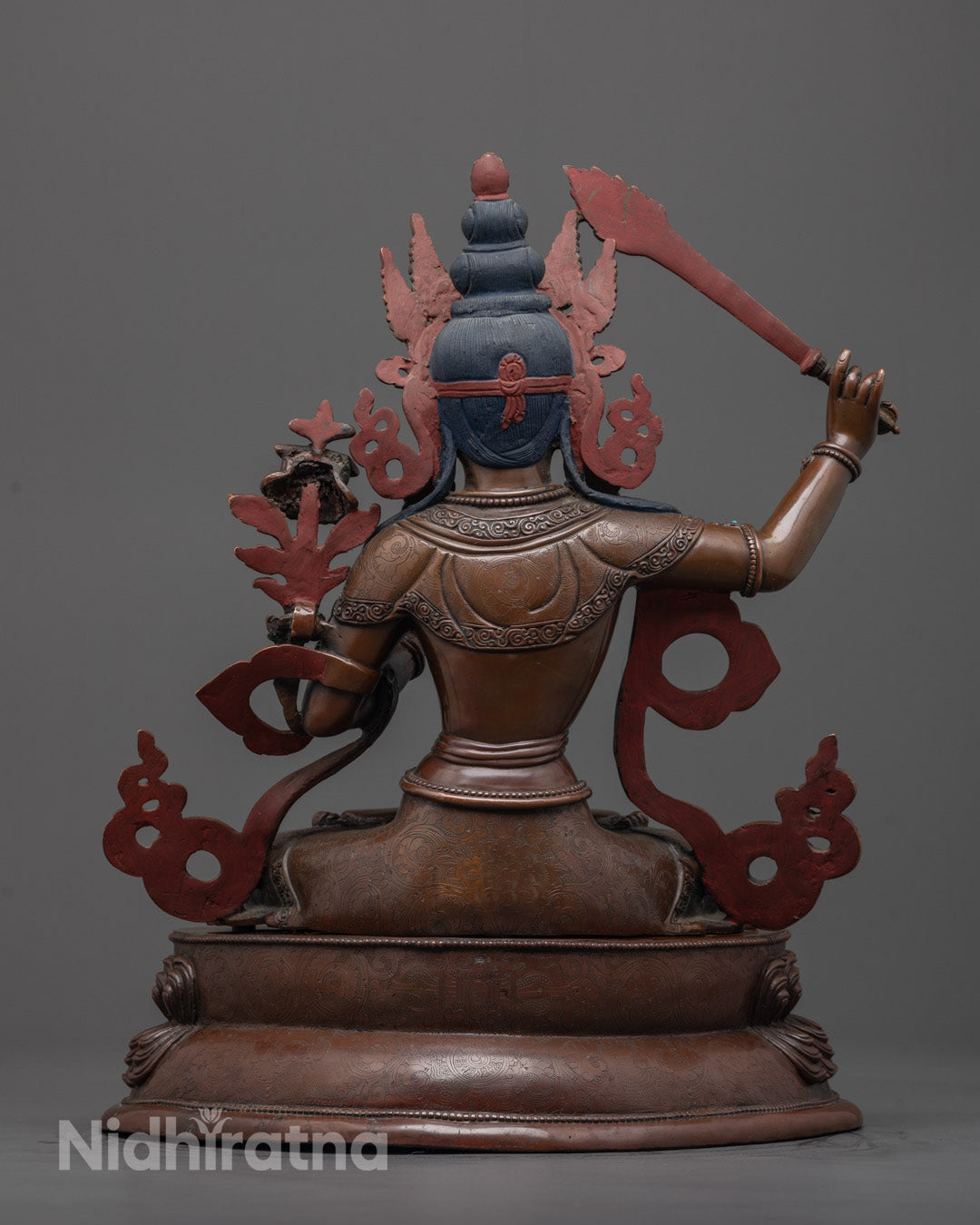 Back-View of Tibetan Buddhist Manjushri Sculpture Holding Wisdom Sword and Sacred Text