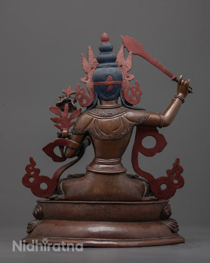 Back-View of Tibetan Buddhist Manjushri Sculpture Holding Wisdom Sword and Sacred Text