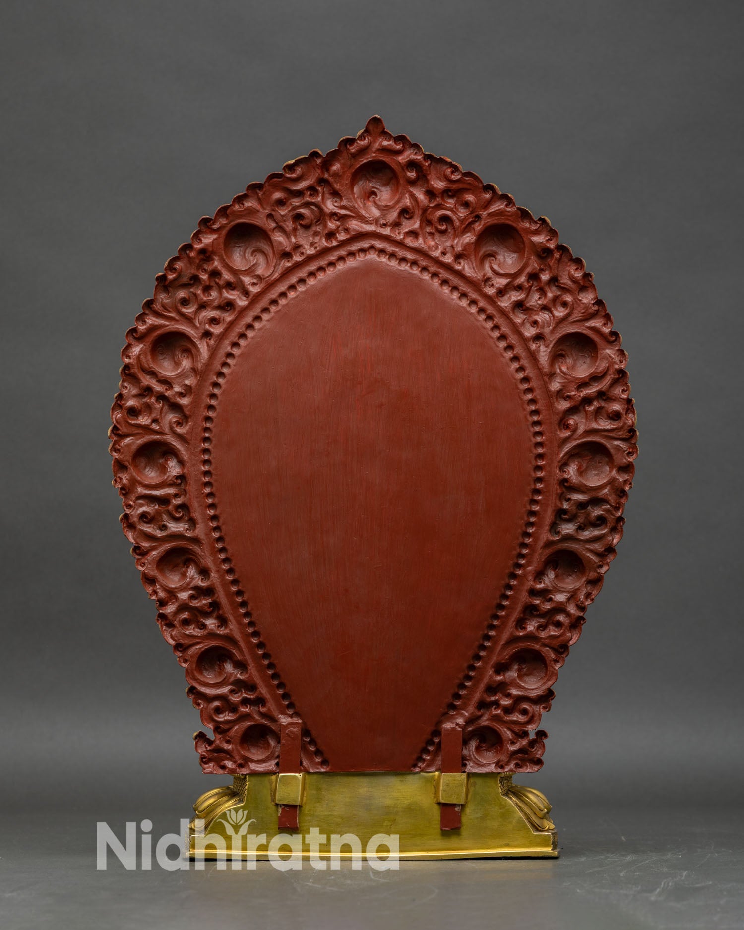 Back view of Achi Chokyi Drolma, detailed floral scrollwork halo and lotus base
