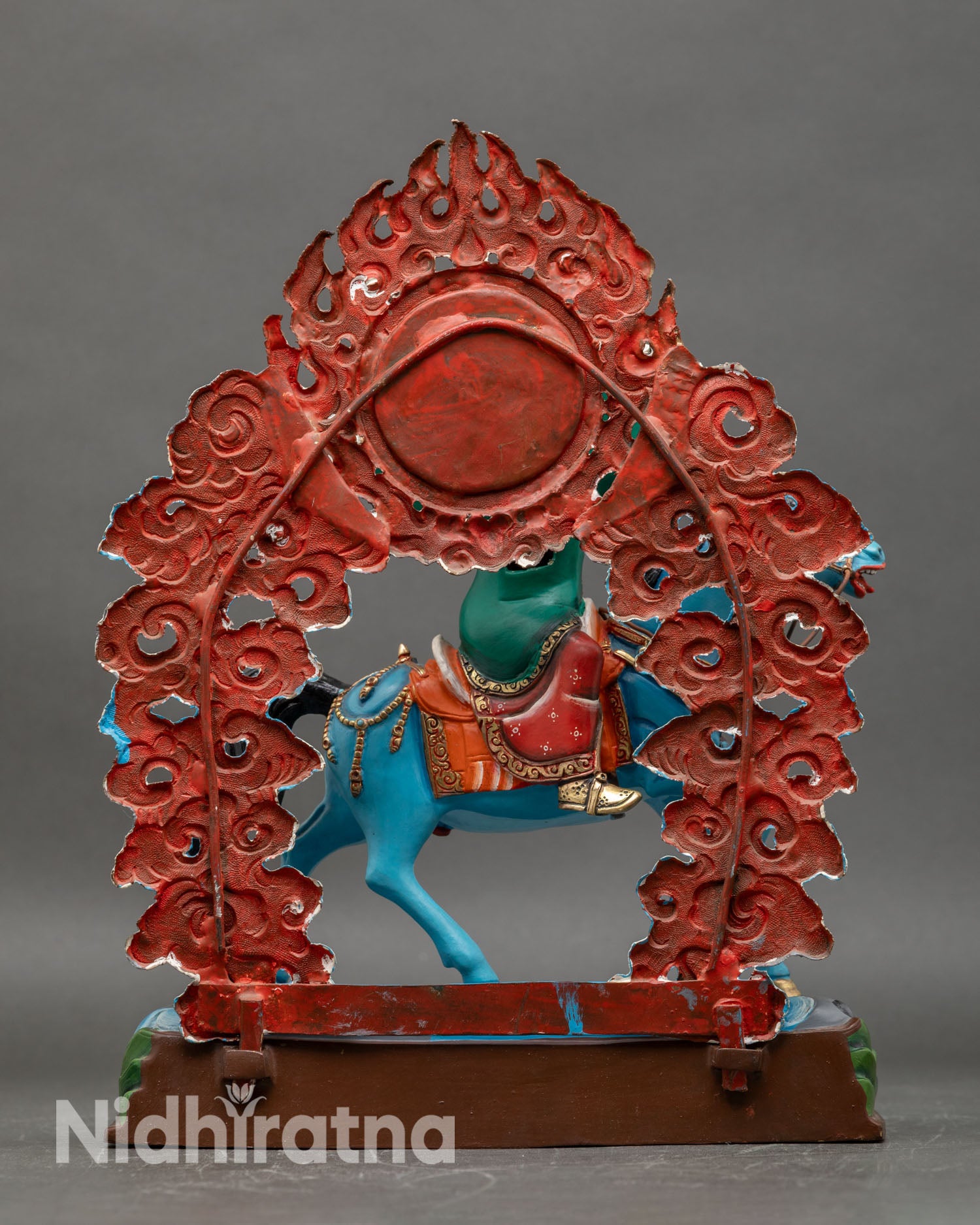 Back view of Achi Chokyi Drolma statue , flowing robes detailed carvings Himalayan sacred art