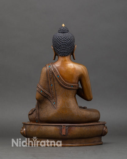 Back-view-Amoghasiddhi-Buddha-statue-intricate-robes-lotus-motifs-Himalayan-meditation-decor