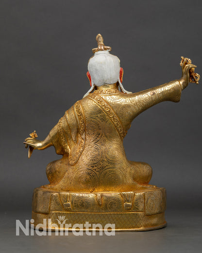 Back view Dudjom Lingpa Rinpoche – intricate swirling cloud patterns on copper statue