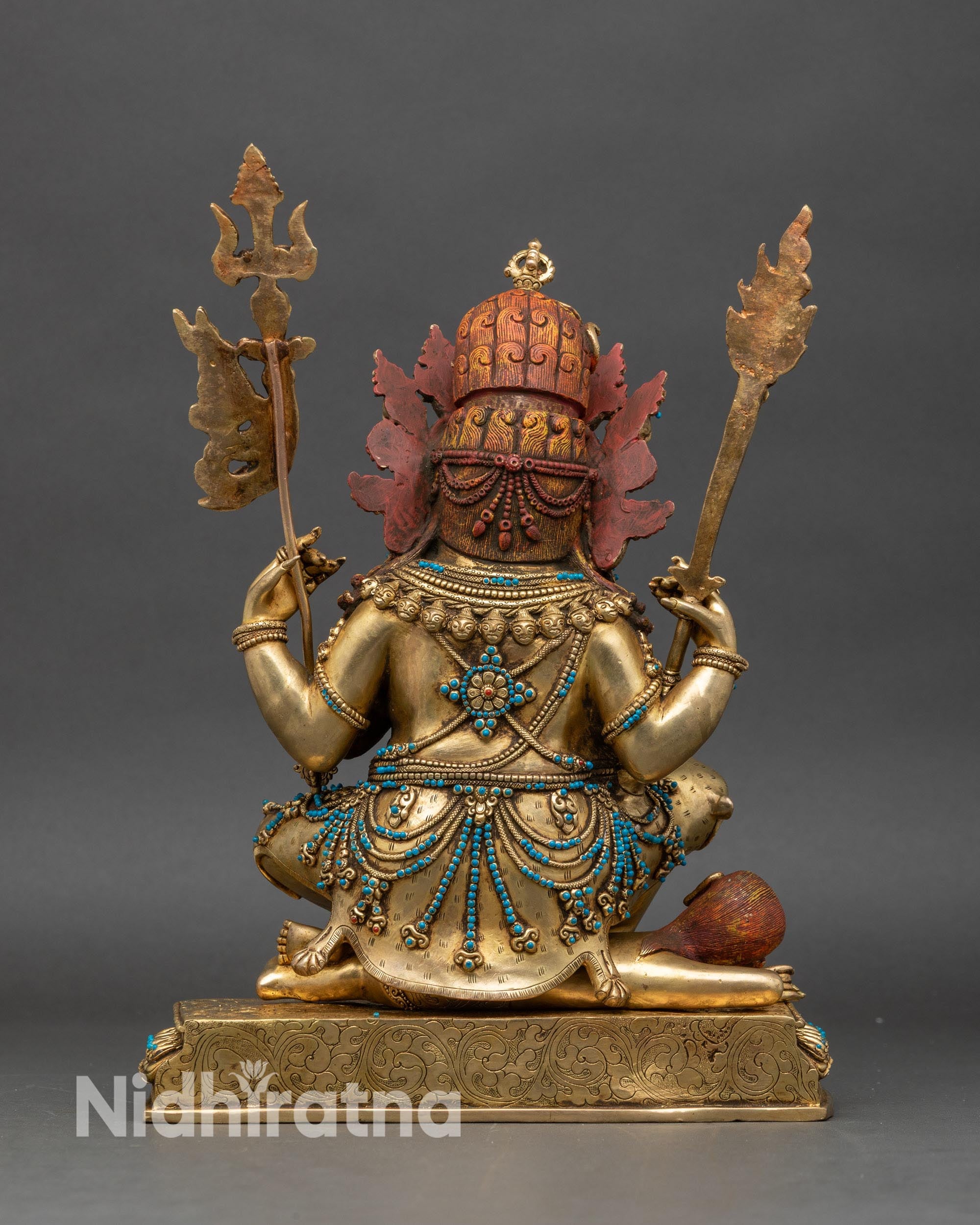 Back view of Four-Armed Mahakala Statue, lotus seat and ornate traditional detailing