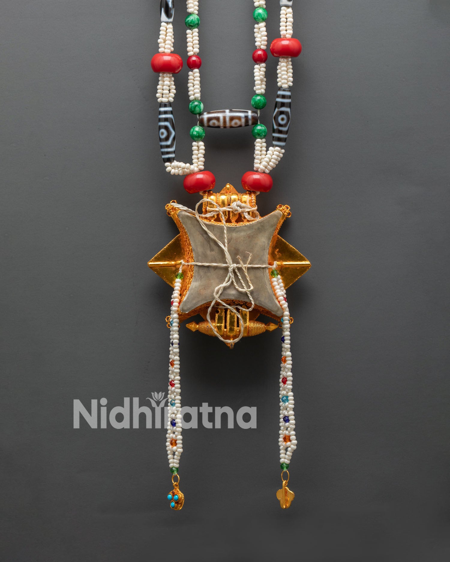 Back view of Ghau Mala gold plated beads engraved details handmade Tibet spiritual art
