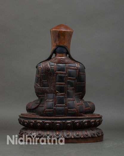 Back view of Karmapa Statue, intricate detailing, oxidized copper, Newari artisan craft