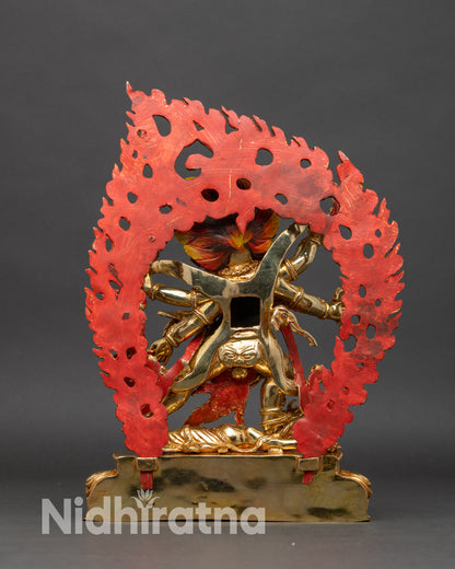 Side view Six-Armed Mahakala statue tiger skin crown of skulls ritual implements