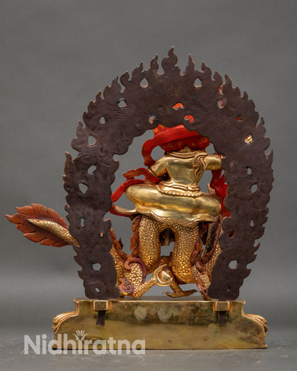 Back view White Dzambhala statue blazing halo ornate robes Tibetan Buddhist sculpture