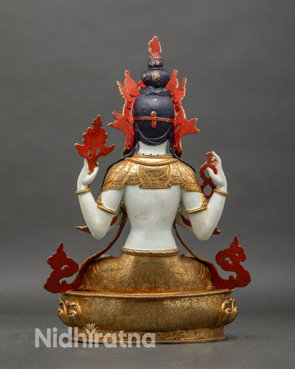 Back view of Chenrezig Buddha statue seated on lotus-pedestal for meditation and home-decor