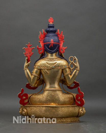 Back view of Chenrezig statue showing engraved lotus pedestal and hollow chamber for mantras