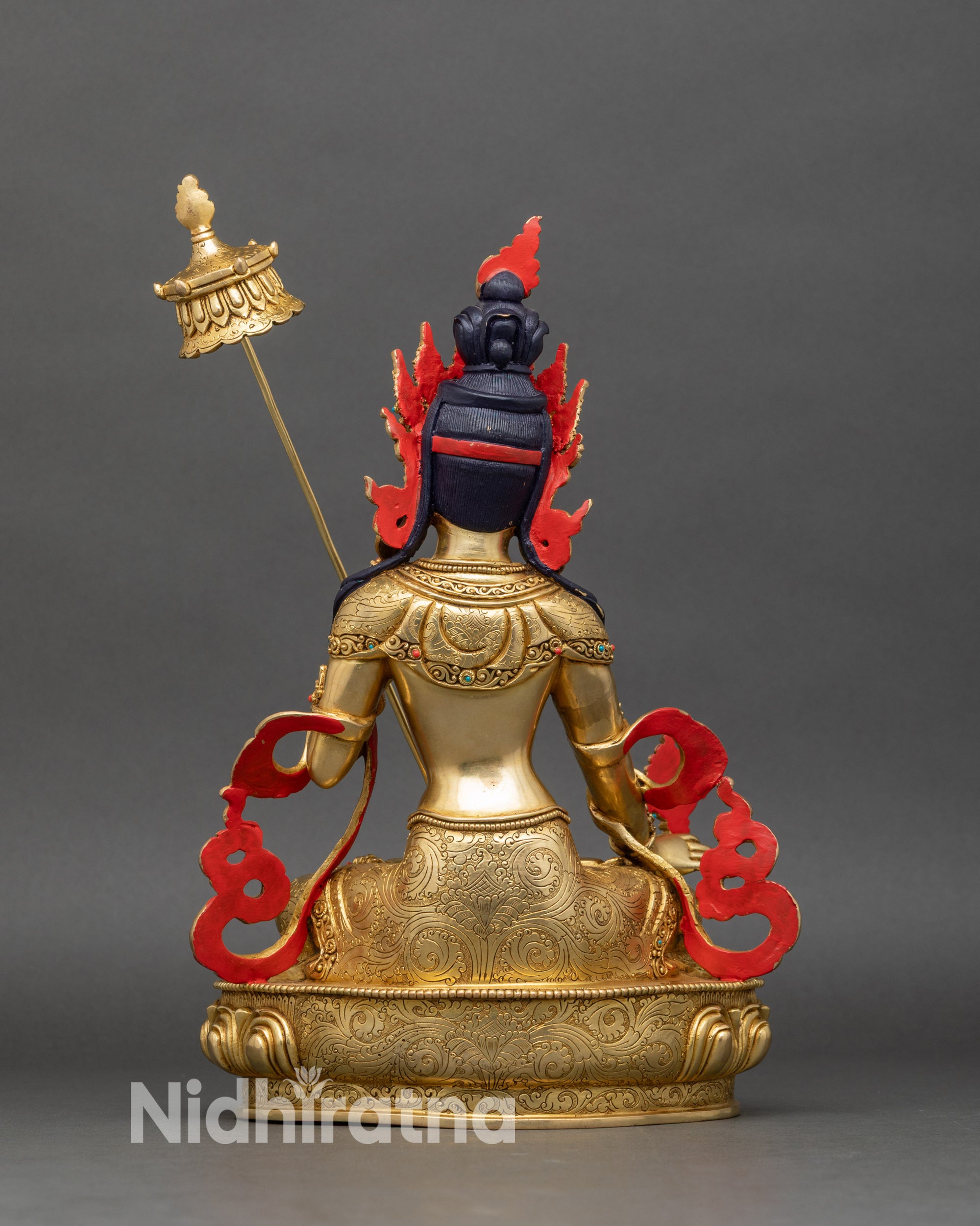 Back view of Dukar Sitatapatra statue, lotus throne and detailed robes visible