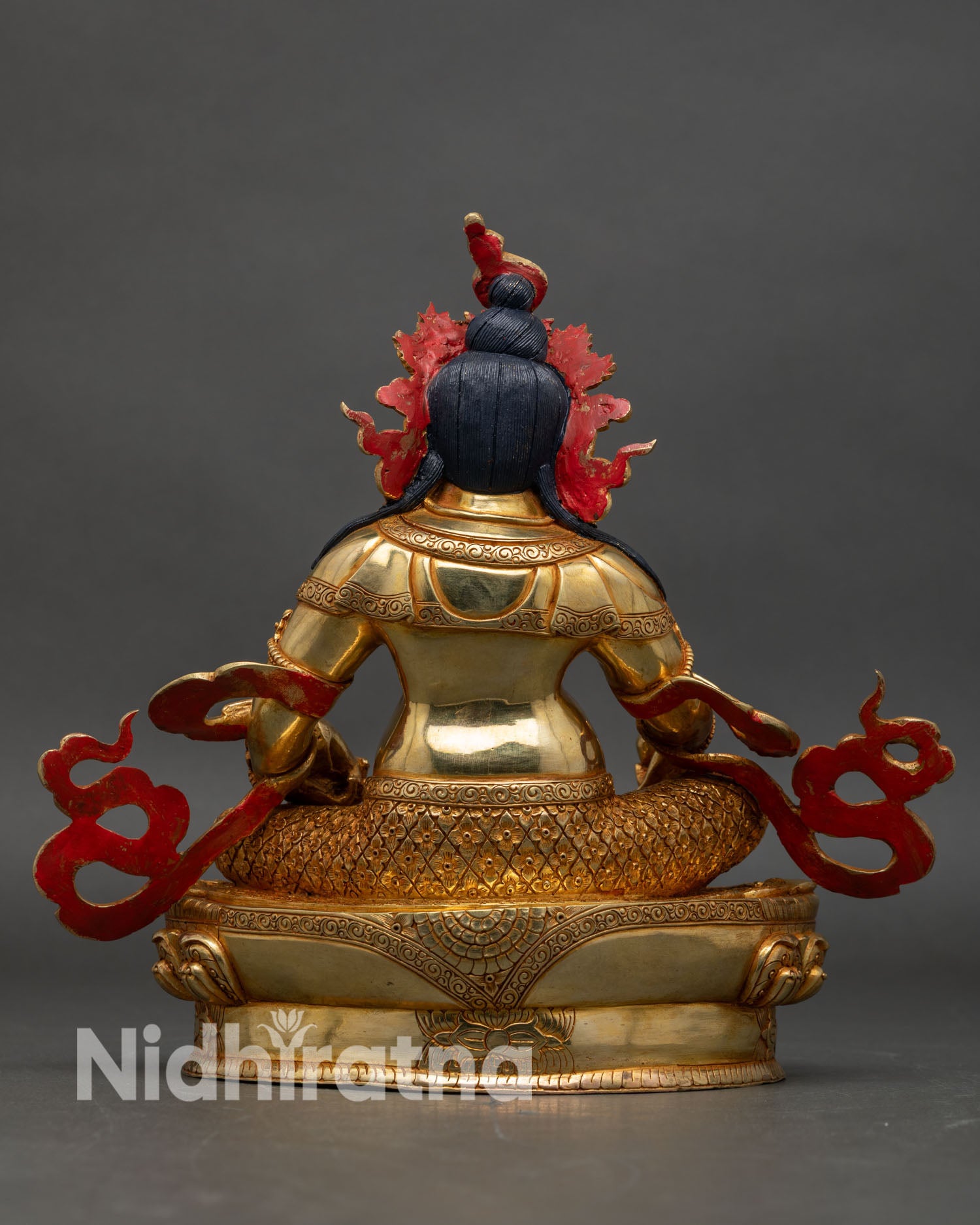 Back view of Dzambhala Statue detailed carvings golden Buddha wealth deity altar display