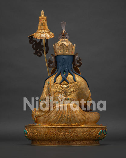 Back view of Guru Norlha statue, cloud motif halo with turquoise beads, 24K gold fire-gilded copper