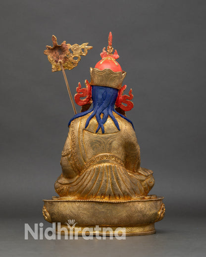 Back view of Guru Norlha statue showing lotus seat and detailed copper carving