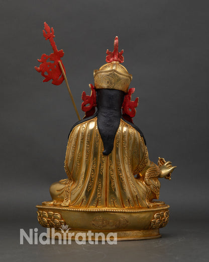 Back view of Guru Rinpoche Statue hand-carved copper intricate 3D relief craftsmanship Himalayan artwork