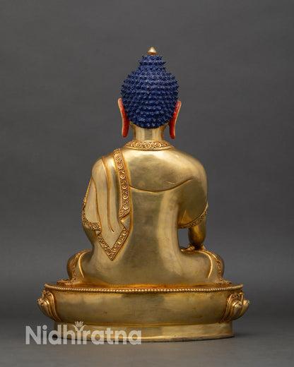 Back view of Himalayan Shakyamuni Buddha statue showing craftsmanship and lotus pedestal