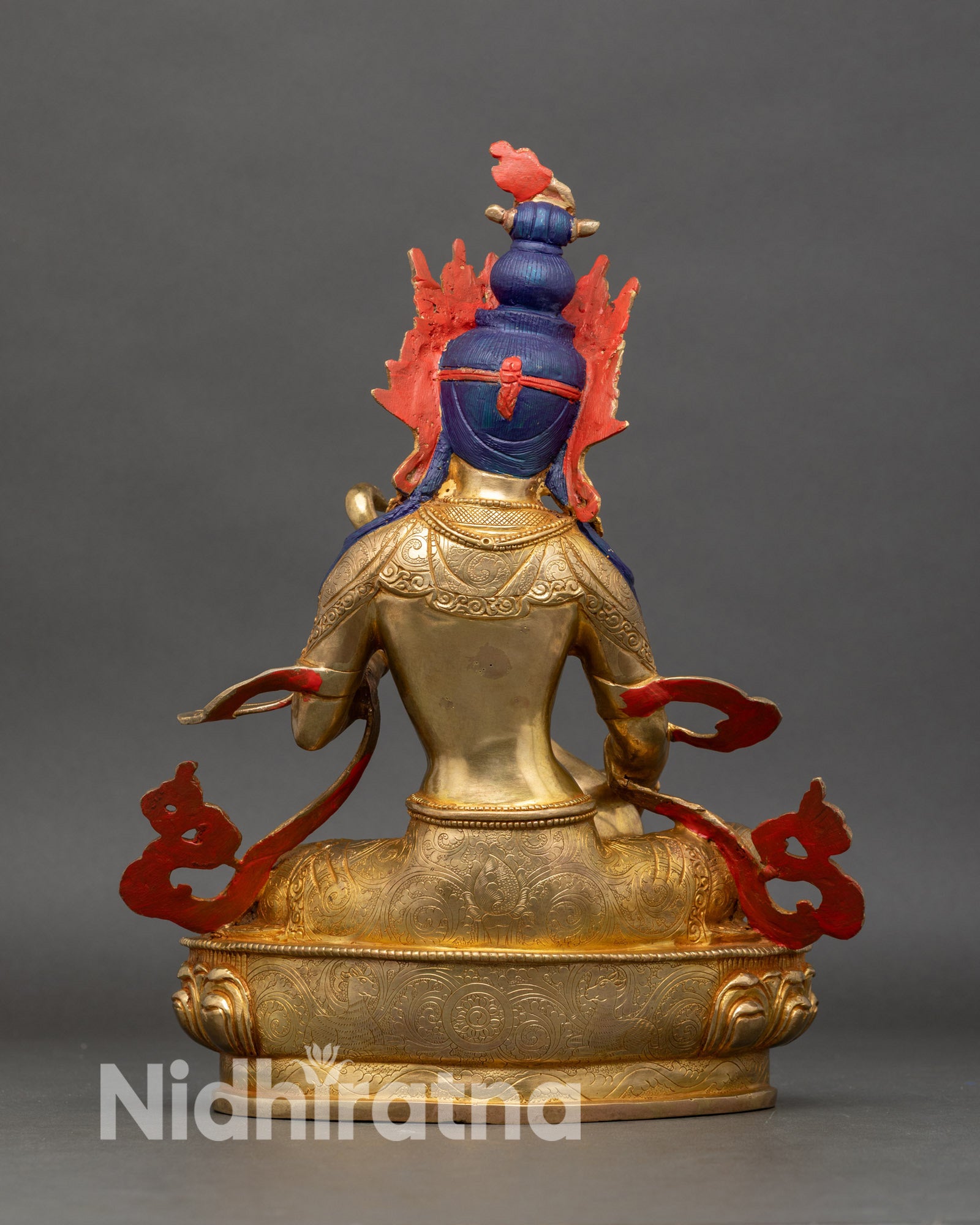 Back view of Saraswati statue with detailed carving and lotus throne Nepalese artwork