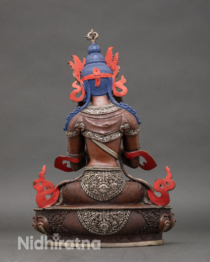 Back view of Vajradhara statue on lotus throne for devotional practice and altar display