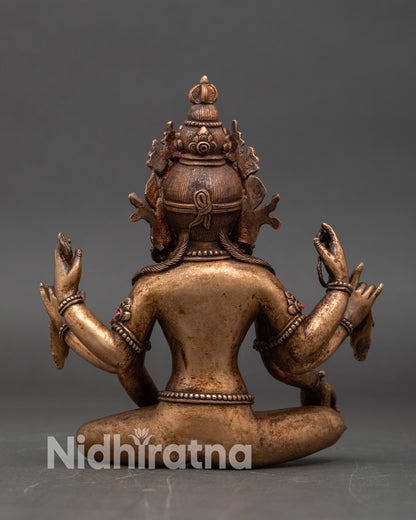 Back view of Vasudhara statue showing oxidized copper and bronze Himalayan craft
