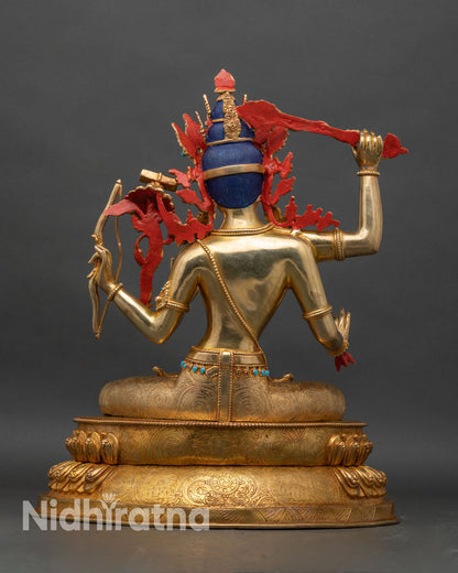 Back view of Maha Manjushri statue with detailed robe patterns and lotus throne engraving