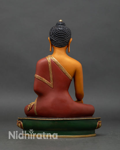 Back view of Shakyamuni Buddha statue, intricate carvings on lotus throne and robe
