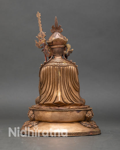 Back view of Guru Tsokye Dorje statue showing oxidized finish and detailed lotus pedestal