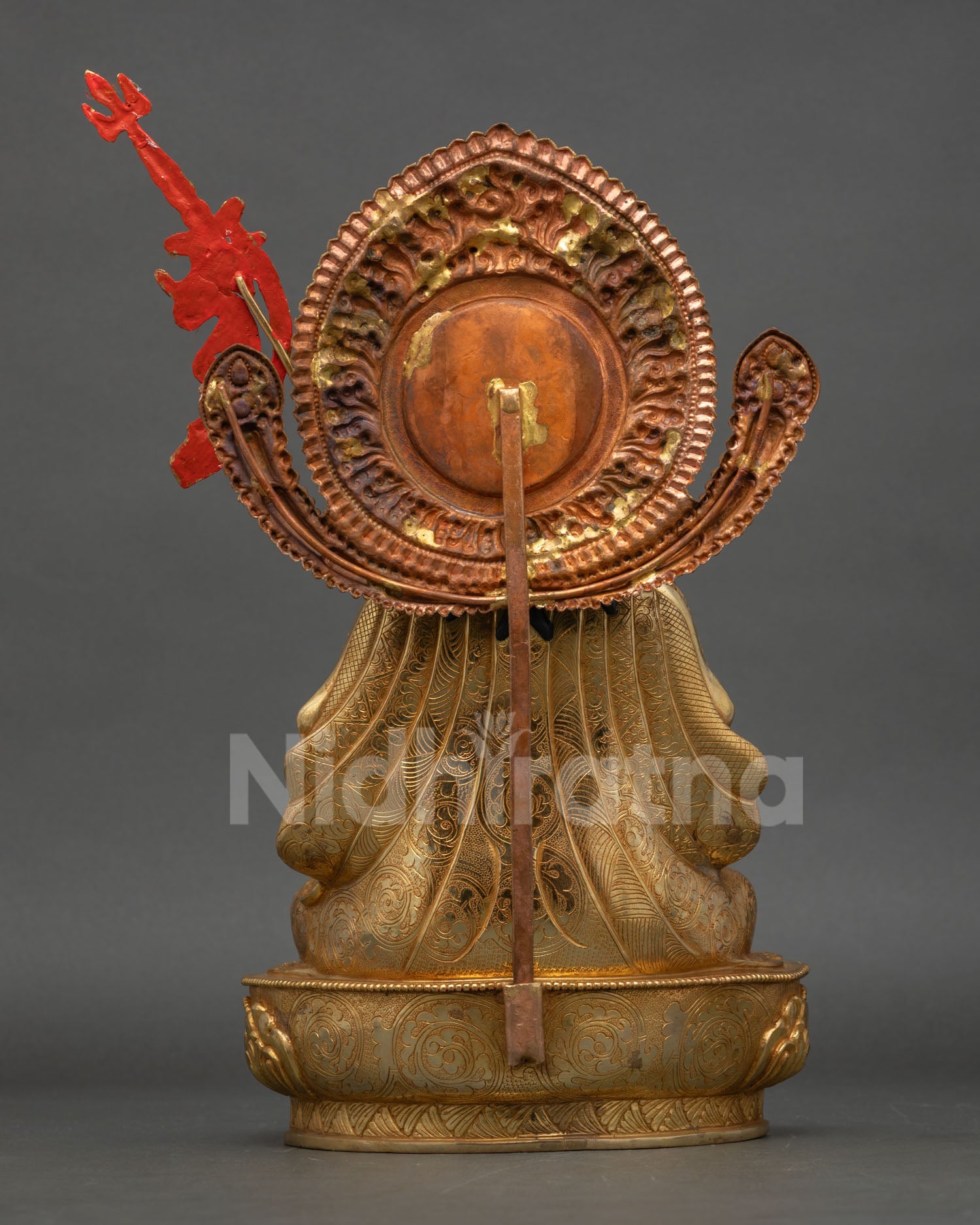 Back view Tsokye Dorje statue detailed copper craftsmanship showing engraved ornaments, flowing robe design and lotus base structure