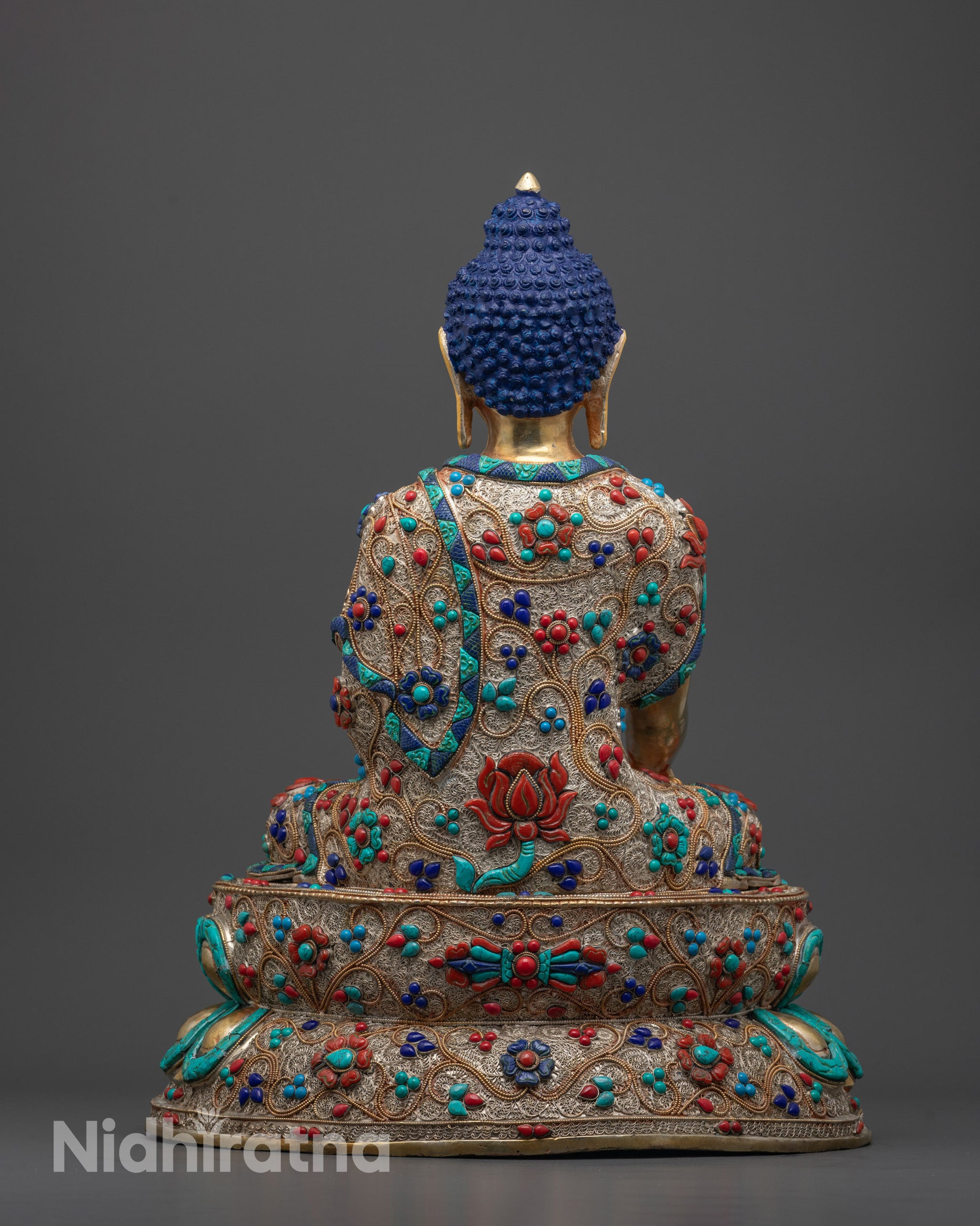 Back-view of Artisan’s detailed hand carving process of Shakyamuni Buddha Statue