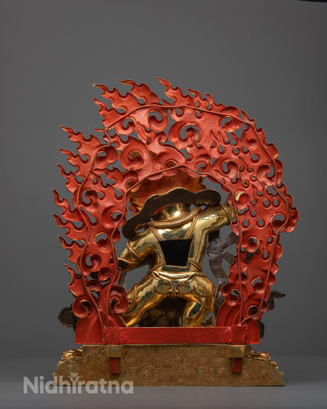 Back-view of Traditional copper-based Vajrapani sculpture with intricate fire-gilded