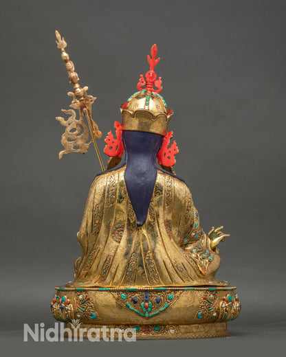 Back view of Padmasambhava statue, copper surface, gold fire-gilding, and engraved decorative elements