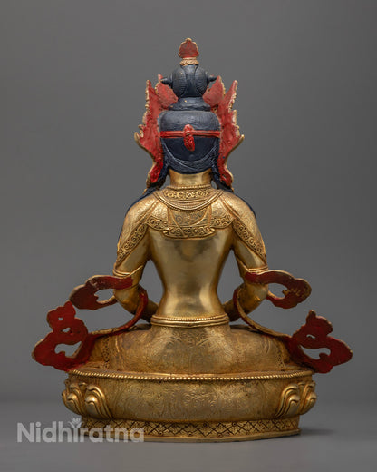 Highlights the consecrated hollow chamber for mantras or relics and the rich symbolism of the statue’s flowing robes and base design.