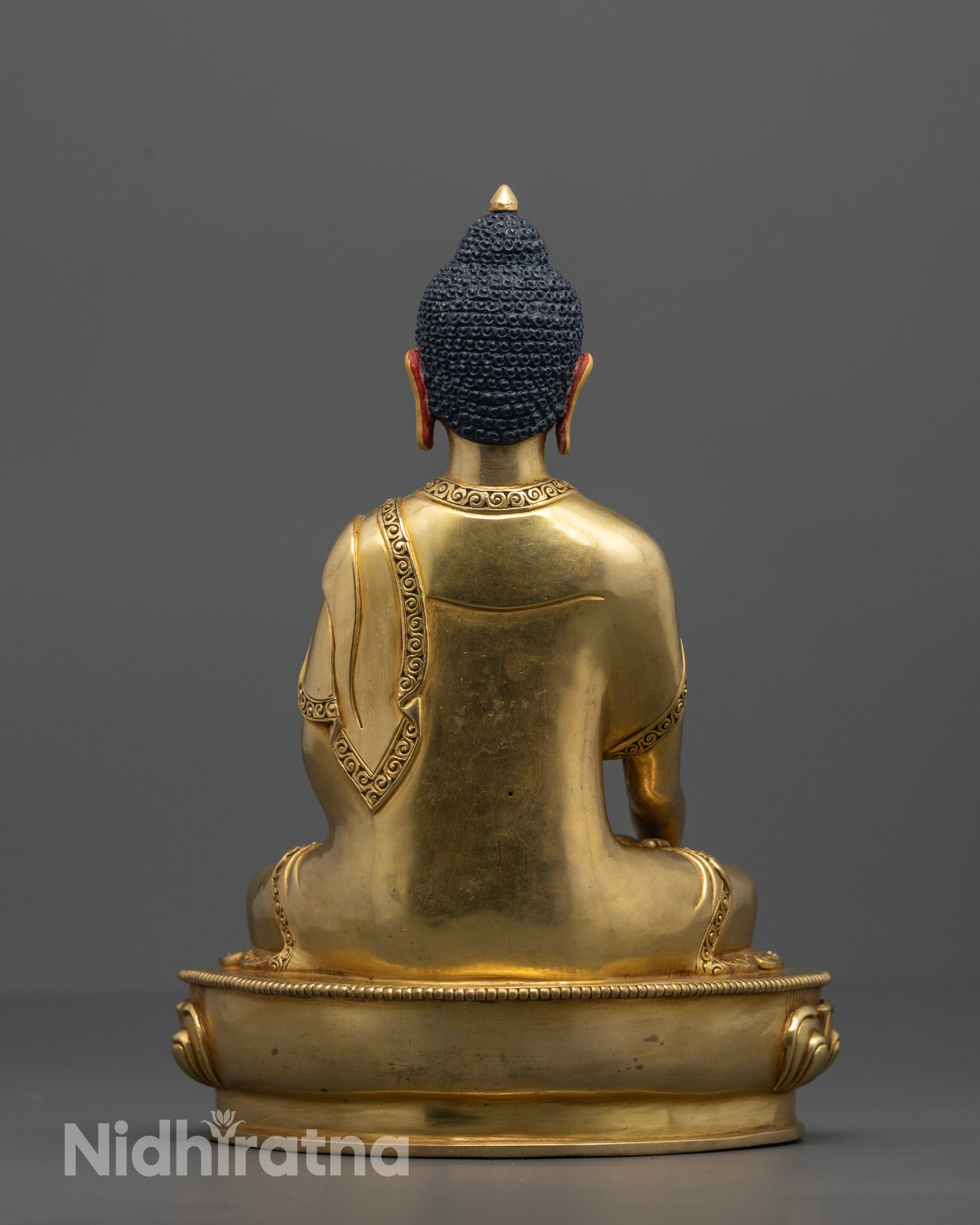 Back View of Shakyamuni Buddha Statue Showcasing Detailed Lotus Throne